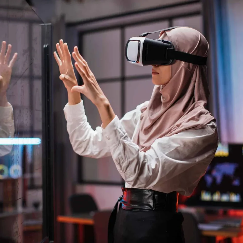 confident-muslim-woman-in-hijab-using-innovative-technology-during-business-strategy-1-1